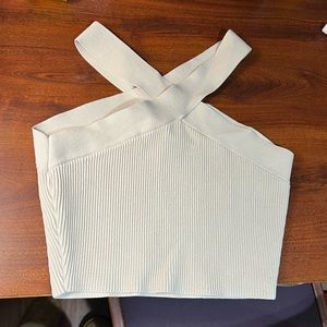 This is a cropped dress shirt. Cross neck line.